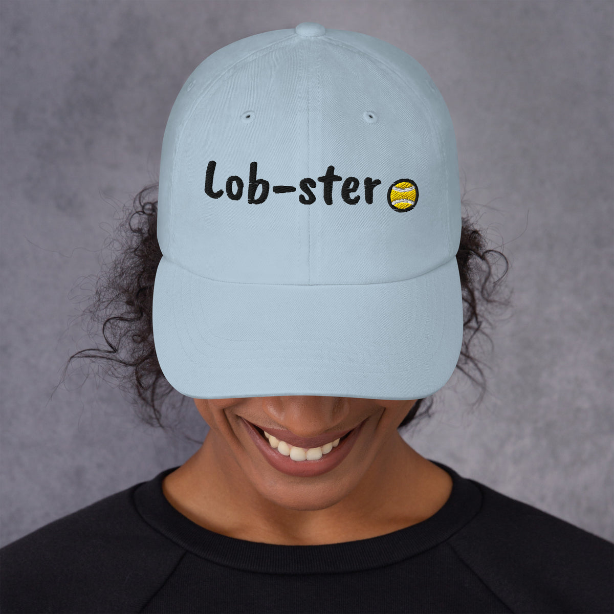 Ocean blue padel dad cap with the Lob-ster design embroidered on the front, front view