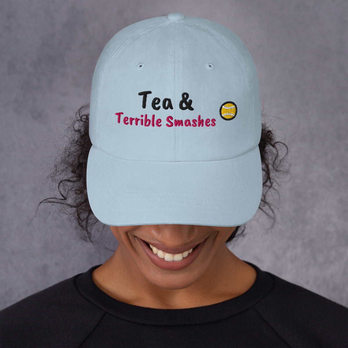 Ocean blue padel dad cap with the Tea & Terrible Smashes design embroidered on the front, front view