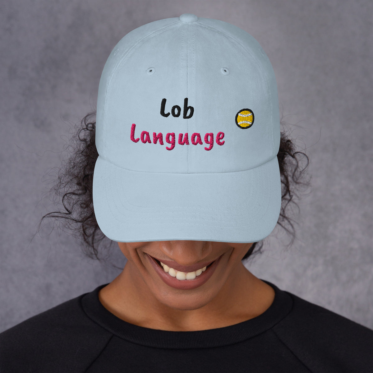 Ocean blue padel dad cap with the Lob Language design embroidered on the front, front view