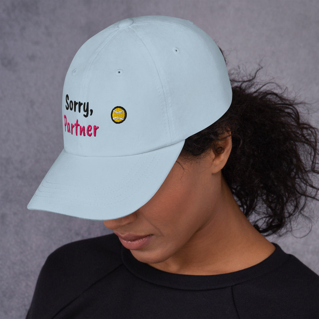 Ocean blue padel dad cap with the Sorry, Partner design embroidered on the front, left side view