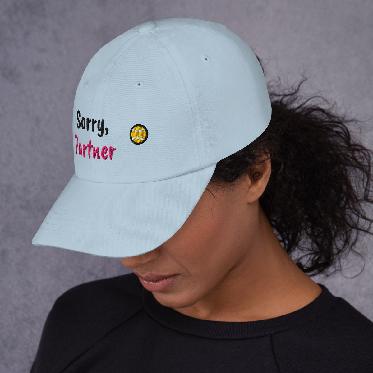 Ocean blue padel dad cap with the Sorry, Partner design embroidered on the front, left side view