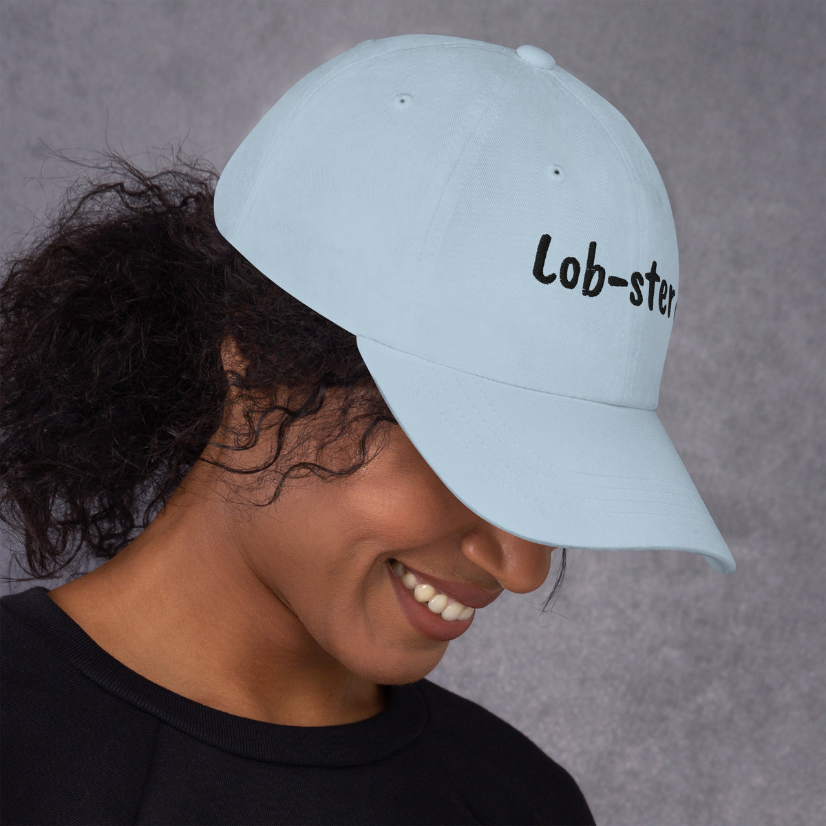 Ocean blue padel dad cap with the Lob-ster design embroidered on the front, right side view