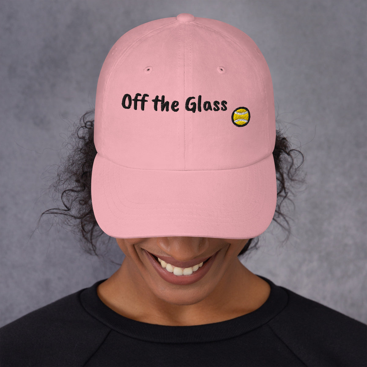 Pink padel dad cap with the Off the Glass design embroidered on the front, front view