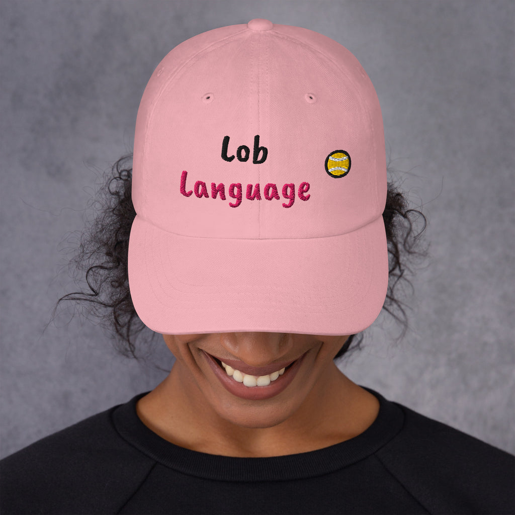 Pink padel dad cap with the Lob Language design embroidered on the front, front view