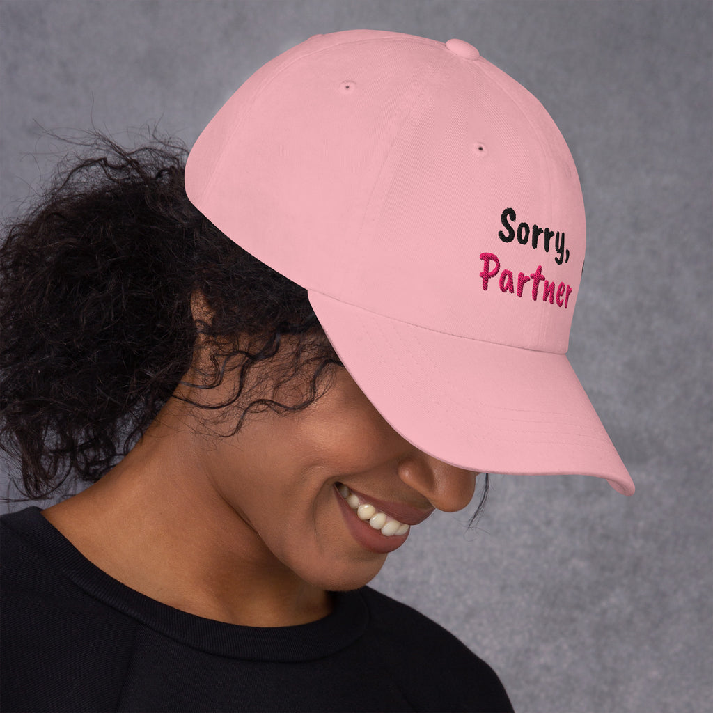 Pink padel dad cap with the Sorry, Partner design embroidered on the front, right side view