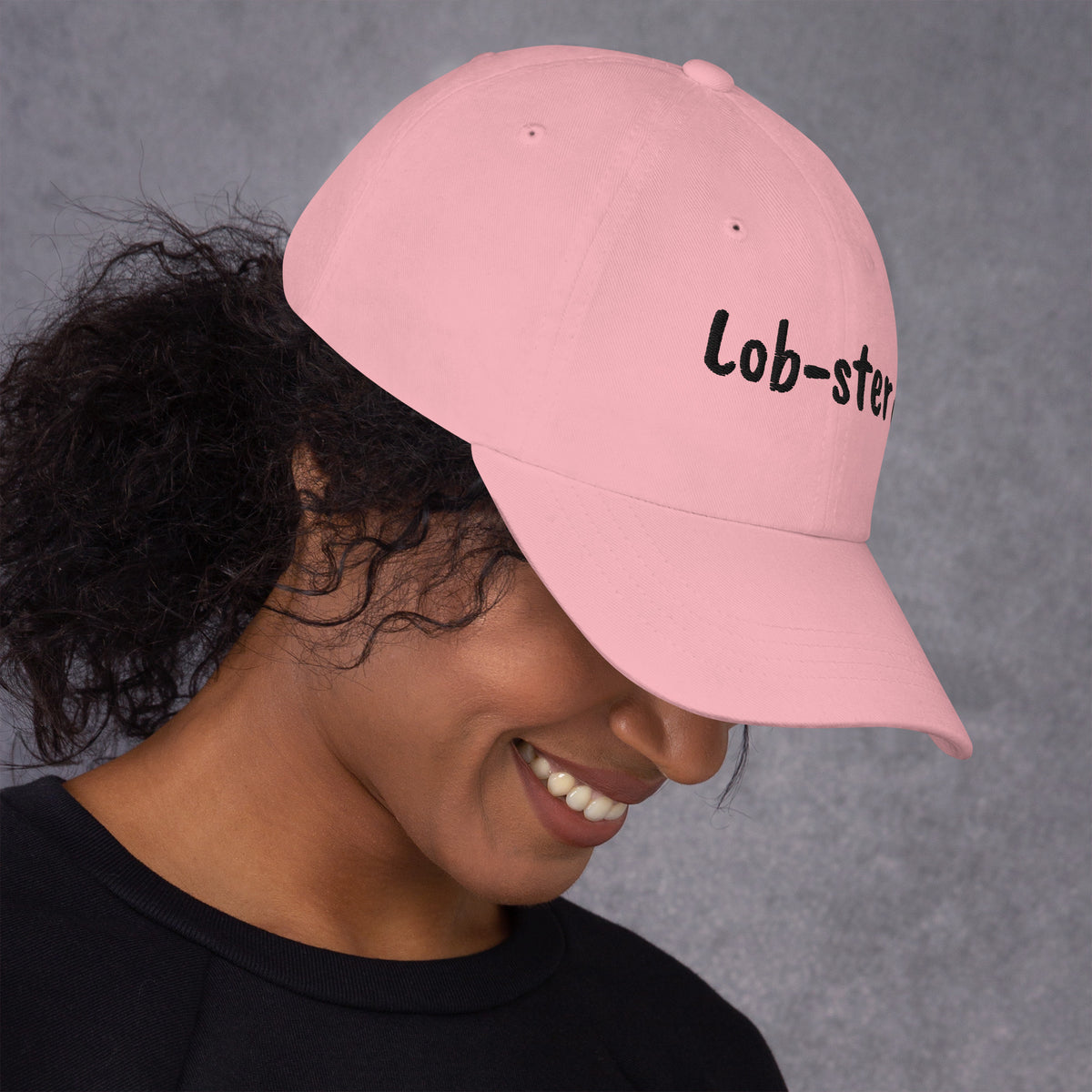 Pink padel dad cap with the Lob-ster design embroidered on the front, right side view