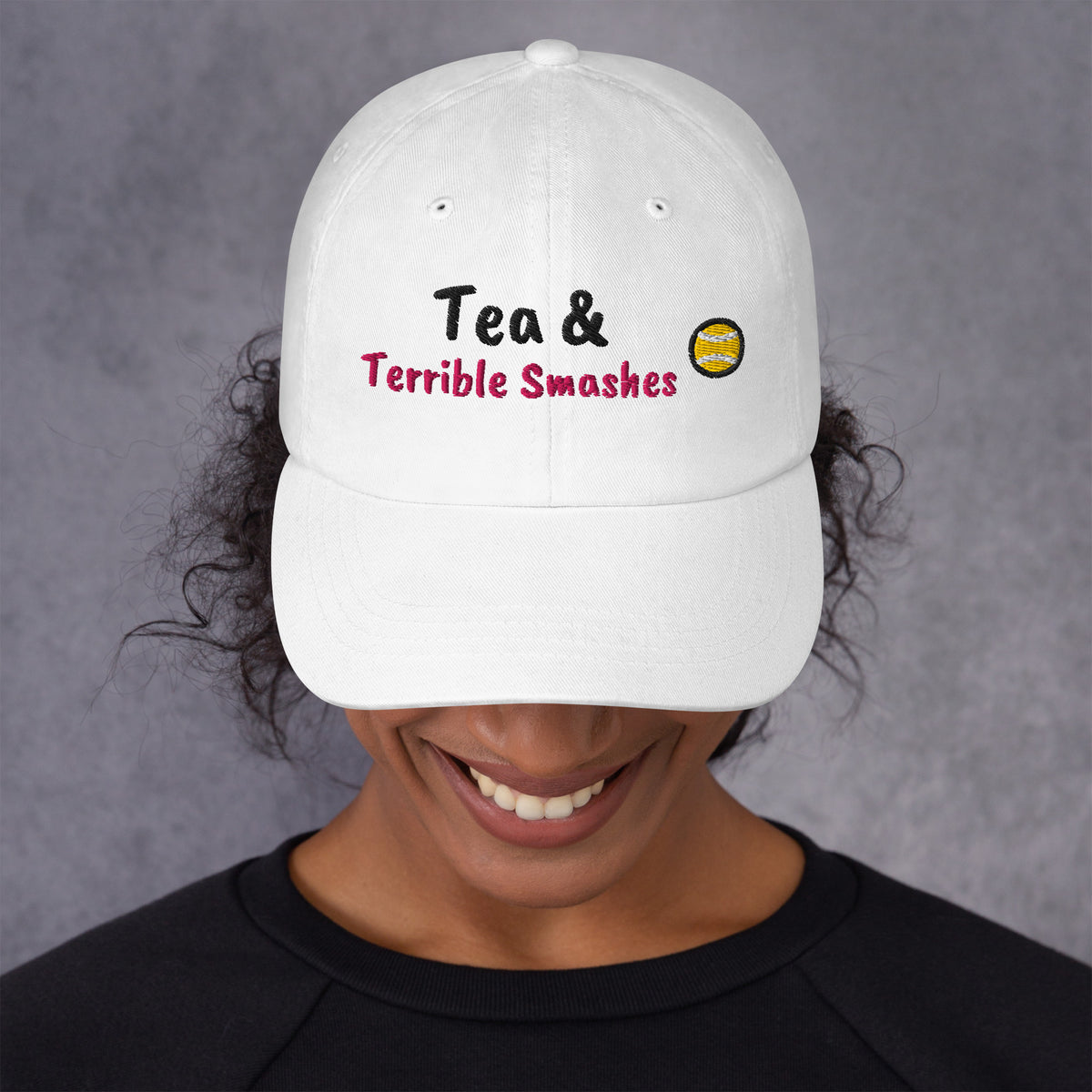 White padel dad cap with the Tea & Terrible Smashes design embroidered on the front, front view