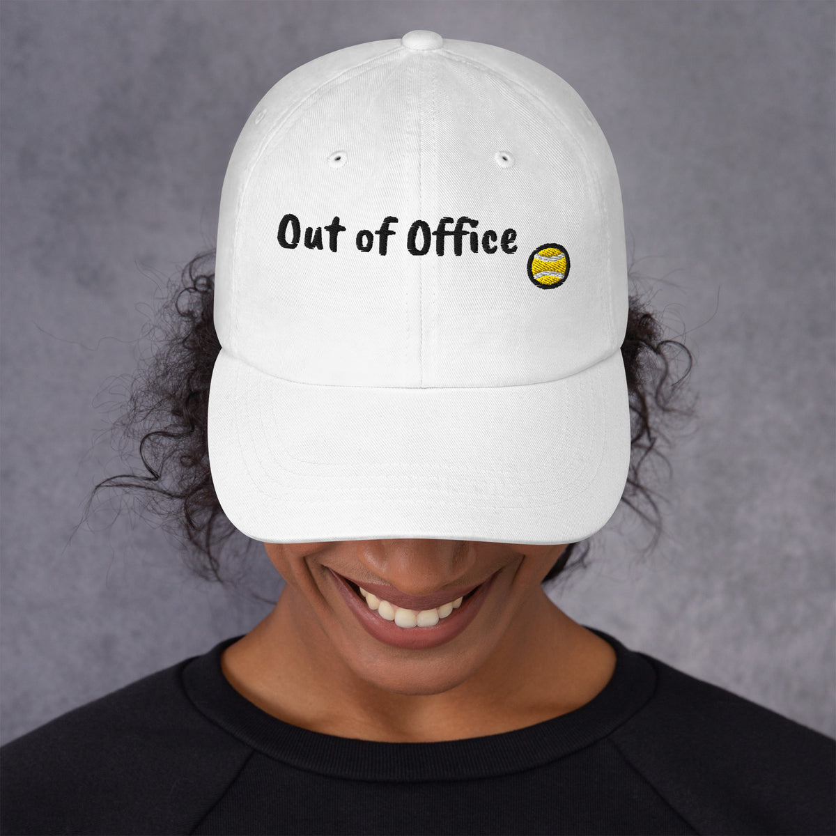 White padel dad cap with the Out of Office design embroidered on the front, front view