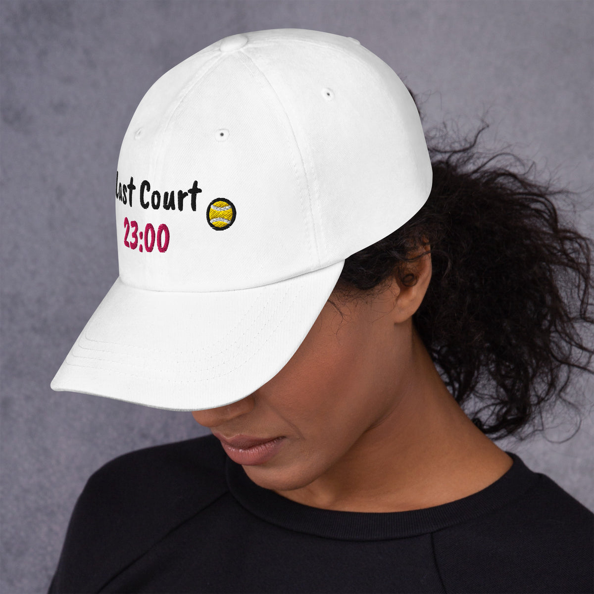 White padel dad cap with the Last Court 23:00 design embroidered on the front, left side view