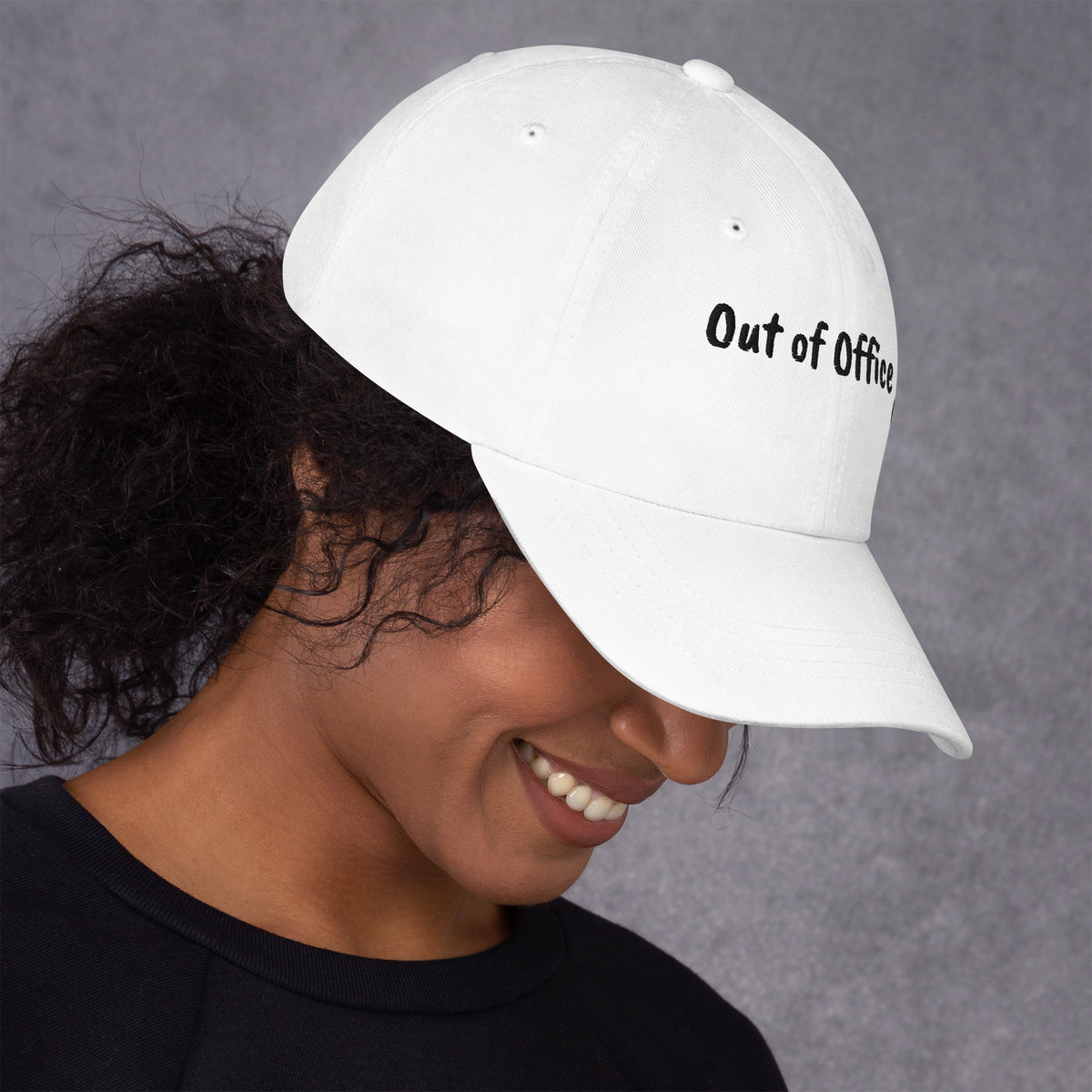 White padel dad cap with the Out of Office design embroidered on the front, right side view
