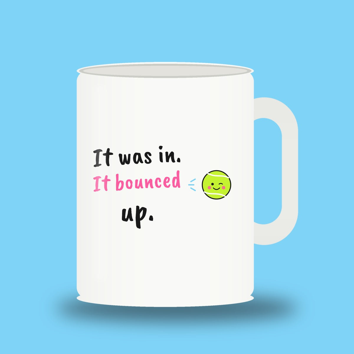 White 11 oz padel mug with the slogan “It was in. It bounced up.”