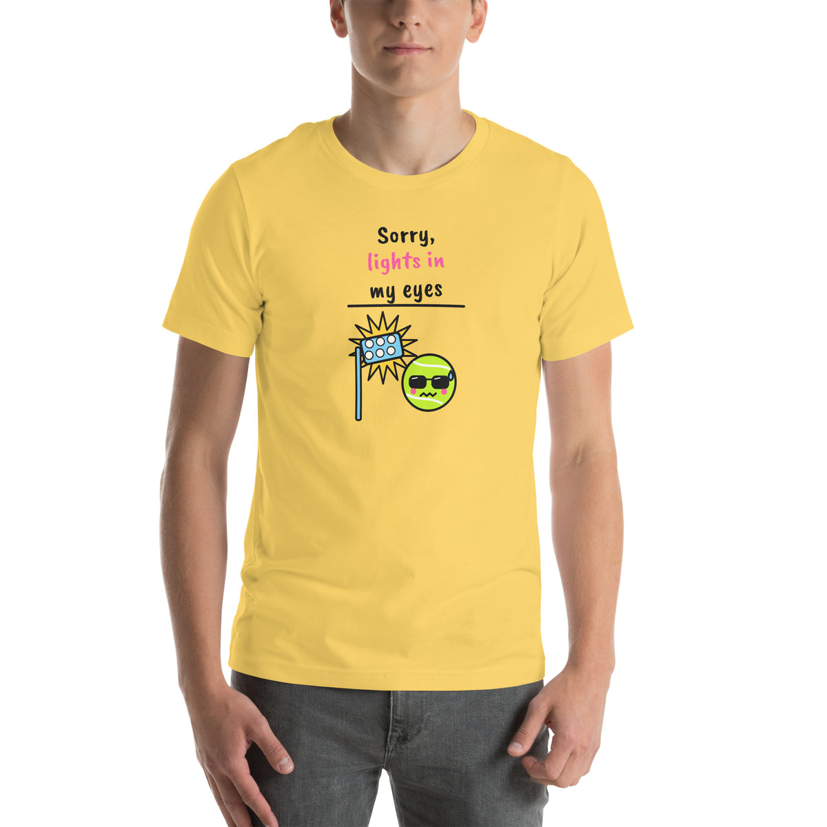 Front of the yellow Sorry, Lights In My Eyes Padel Tee