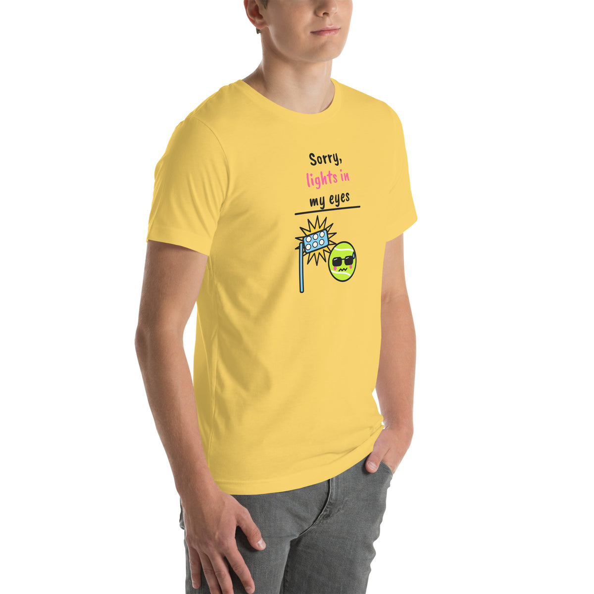 Front-right view of the yellow Sorry, Lights In My Eyes Padel Tee
