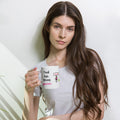 White 11 oz padel mug with the slogan “Tired legs. Strong opinions.”