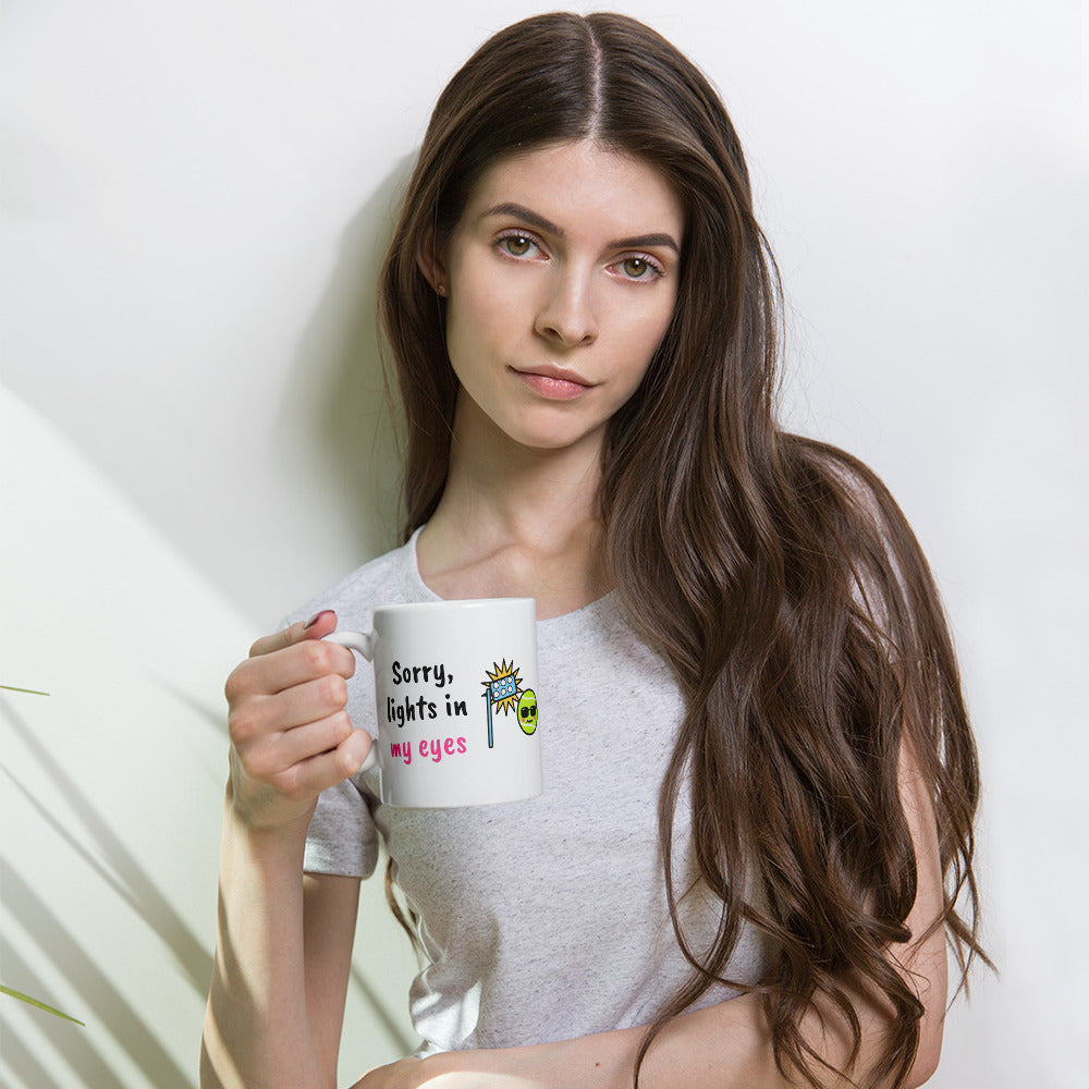 White 11 oz padel mug with the slogan “Sorry, lights in my eyes”